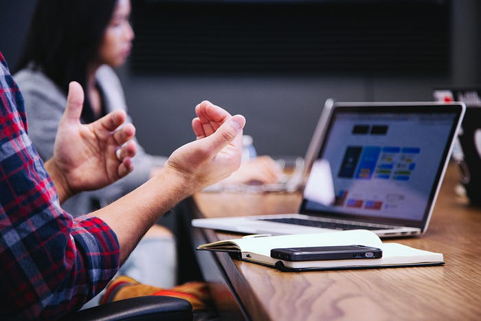 A photograph of a meeting taken by Headway on Unsplash