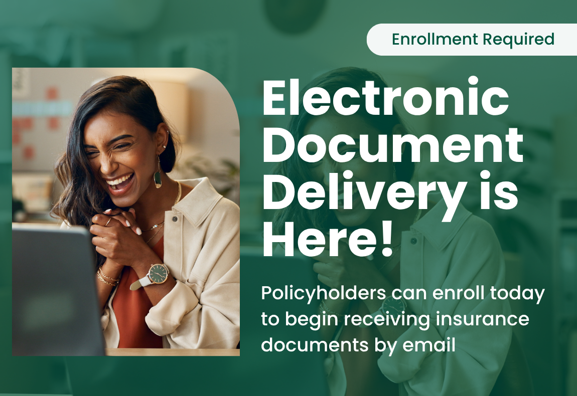 A woman smiling looking at her computer screen